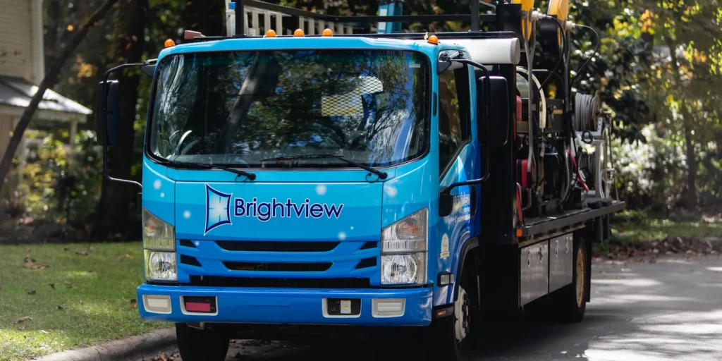 Brightview’s blue equipment truck parked on a residential street