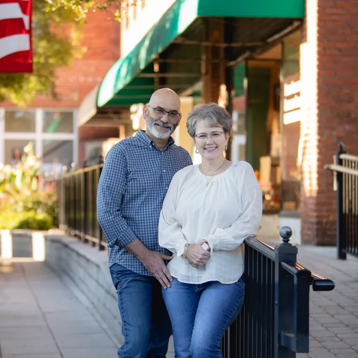 Brightview founders Dale and Monica Pittman standing together on a downtown sidewalk