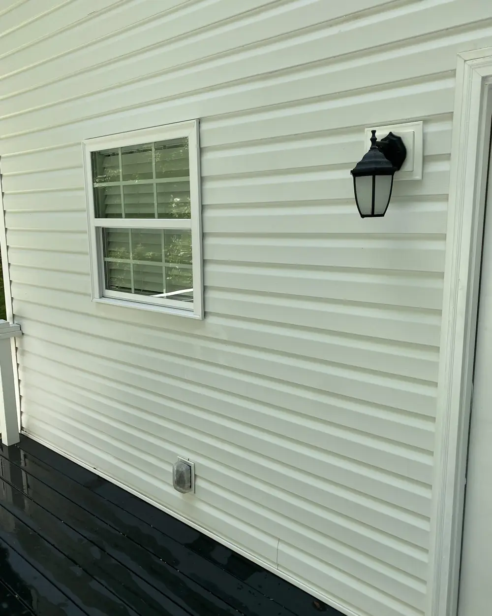 The same siding clean and bright after a Brightview house wash